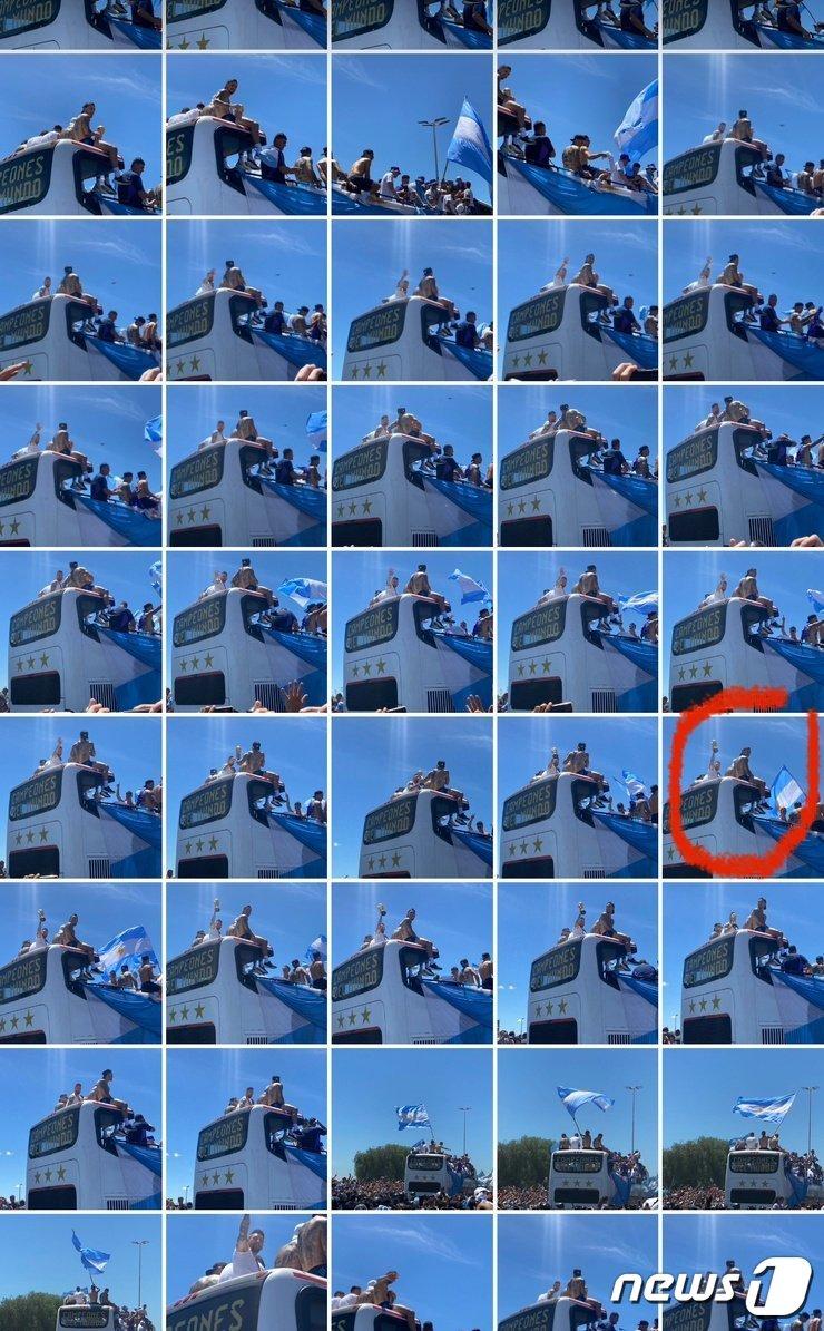 리오넬 메시가 우승컵을 전달받아 드는 순간 하늘에서 빛이 내려오는 모습. 사진을 촬영한 누리꾼은 조작한 것이 아니라며 찍은 사진 전체를 모두 공개했다. &#40;트위터 갈무리&#41;