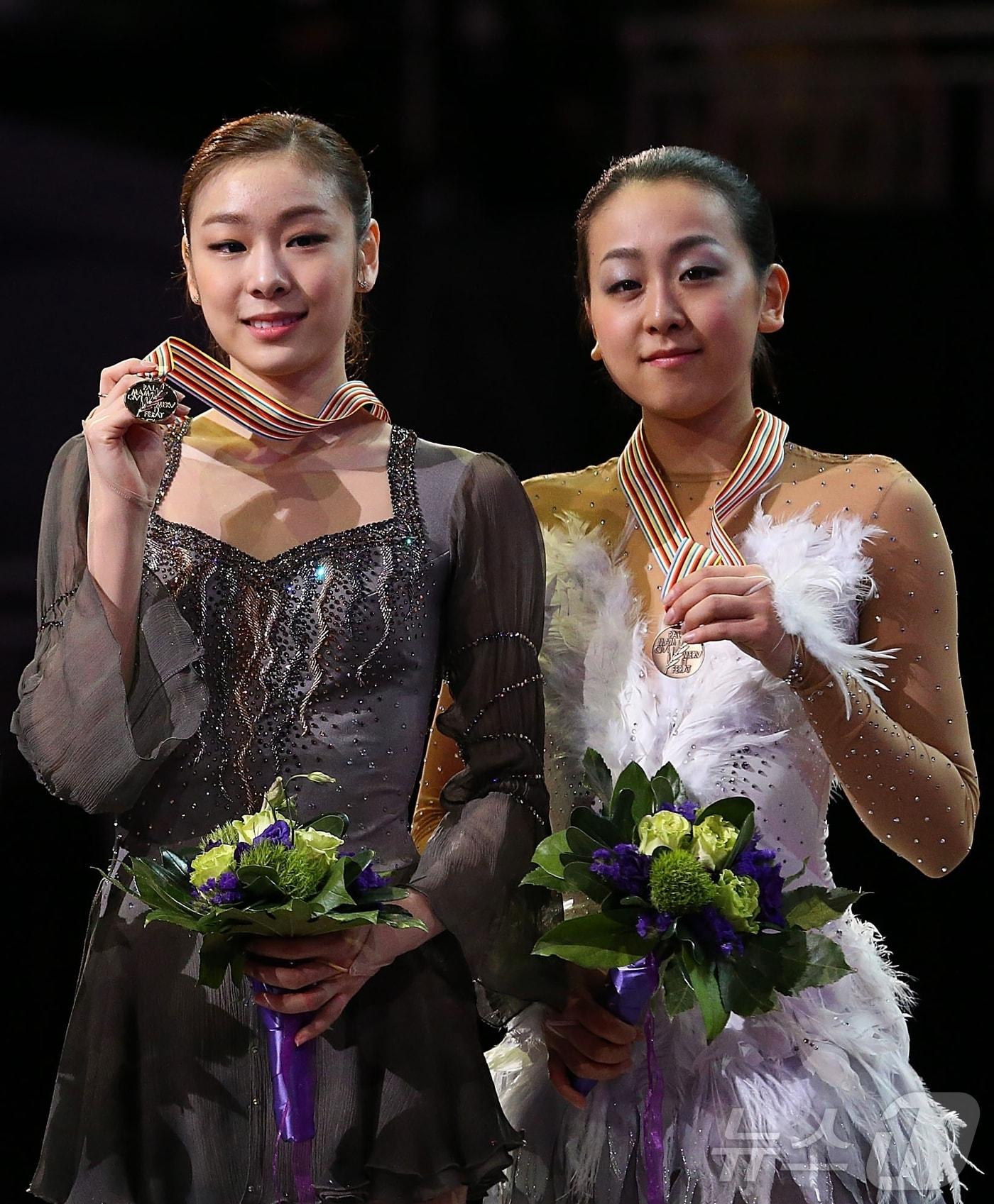 전 피겨 스케이팅 국가대표 선수 김연아&#40;왼쪽&#41;와 일본의 아사다 마오. ⓒ AFP=News1